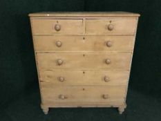 An antique pine six drawer chest