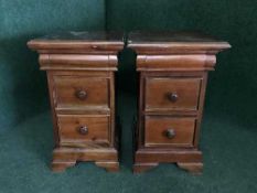 A pair of mahogany bedside stands