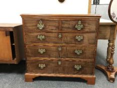 A Georgian mahogany chest of five drawers on bracket feet