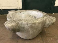 A large stone garden mortar