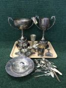 A tray of plated trophies, egg cruet, beakers,
