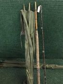 A four piece split cane fishing rod in carry bag and a two piece split cane fishing rod