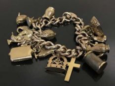 A 9ct gold hollow link charm bracelet, with 9ct heart clasp,