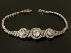 A white gold and diamond set bracelet, the total diamond weight estimated at 2.50 carats, weight 14.