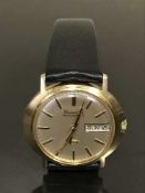 A scarce 9ct gold Bulova Accuquartz wristwatch with Day-Date indication,