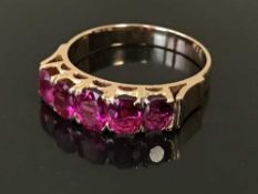 A ruby half-eternity ring, the five rubies estimated to weigh a total of 1.75 carat, 3.