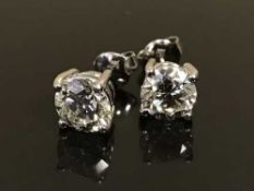 A fine pair of diamond stud earrings, the total diamond weight estimated at 3.