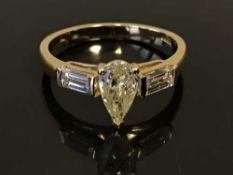 An 18ct gold natural yellow diamond set ring, with diamond set shoulders,