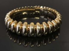 A 18ct gold bangle by Bulgari,