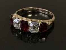 A fine diamond and ruby five stone ring, the total diamond weight estimated at 1.