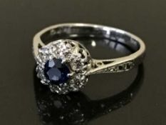 An 18ct white gold sapphire and diamond cluster ring, 2.