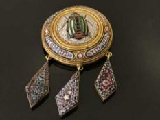 A micro-mosaic brooch depicting a scarab beetle, in yellow metal setting, 15.