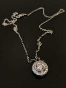 An 18ct white gold diamond set pendant, the principal stone weighing an estimated 0.