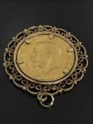 A gold full Sovereign dated 1912, in decorative yellow gold mount, 11.6g gross.