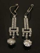 A fine pair of white gold and diamond drop earrings,