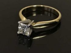 An 18ct gold princess cut diamond solitaire ring, the diamond weighing an estimated 0.
