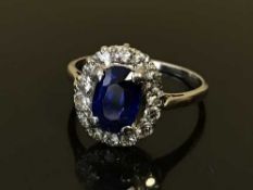 A platinum sapphire and diamond cluster ring