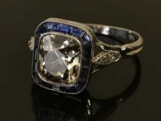A white gold, diamond and sapphire set ring, the total diamond weight estimated at 2.