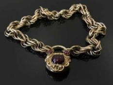 An ornate gold and cabochon garnet mourning bracelet, on rope twist chain, 20.
