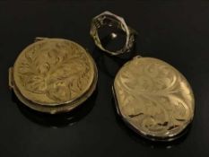 Two 9ct gold lockets, together with a vacant ring mount, probably for a sovereign, 40.9g.