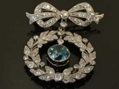 A white gold, diamond and zircon brooch,