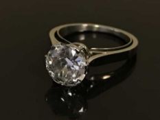 A platinum solitaire ring, the brilliant cut stone weighing approximately 2.