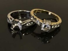 An 18ct gold and diamond set ring, with diamond set shoulders,