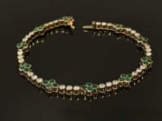 A David Morris 18ct gold, diamond and emerald bracelet, 11.