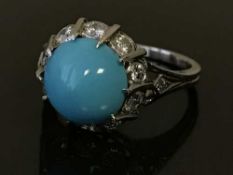 A diamond and turquoise cluster ring, the total diamond weight estimated at 0.