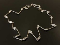 A white gold and diamond set necklace, set with twenty-one marquise cut stones,