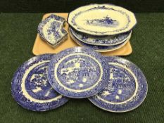 A tray of antique blue and white meat plates, Willow pattern plates,