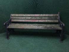 An antique cast iron and wood bench