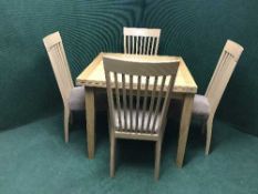 An oak TOT dining table and four high back chairs