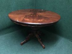 An Italian style pedestal dining table and five chairs