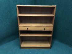 A set of Nathan teak open bookshelves fitted a drawer