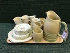 A tray of English pottery Art deco tea service together with a Gray's pottery jug with six tankards