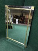 A decorative glass and gilt sectional mirror