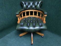 A green buttoned leather chesterfield style swivel desk chair
