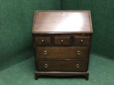 A Stag minstral mahogany bureau fitted with five drawers