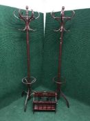 A pair of Bentwood style hat and coat stands together with a magazine rack
