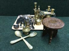 A tray of assorted table cutlery, brass trivet, candlesticks, miniature brass coffee pots,