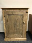A reclaimed pine single door cupboard