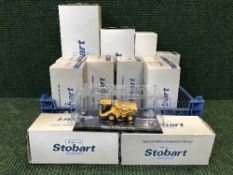 Twelve boxed Eddie Stobart Atlas die cast vehicles