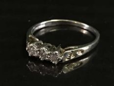 A 9ct gold three stone diamond ring