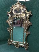 An ornate Rococo style mirror