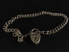 A 9ct gold padlock bracelet, 5.