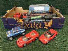 A box of assorted die cast sports cars, boxed Atlas small scale battleships,