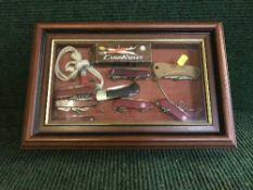 A display case containing a collection of knives