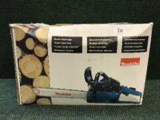A Makita chain saw boxed