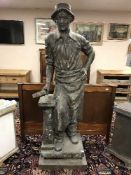 An impressive bronze statue - The Blacksmith with hammer, standing on plinth base, height 190 cm.